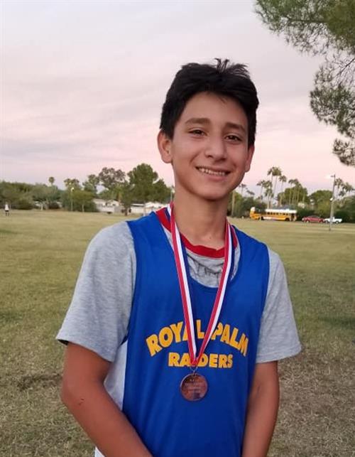 A student wins a medal